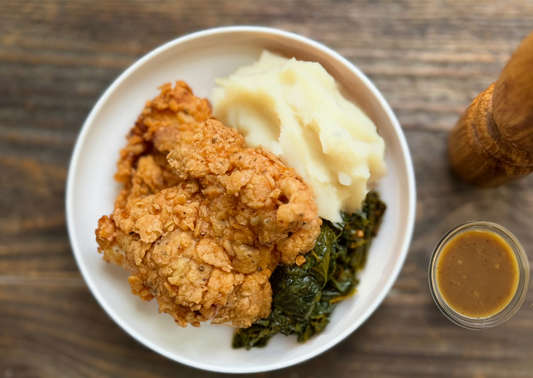 Fried Chicken Thighs with Mashed Potatoes and Collard Greens