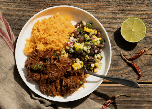 Birria Beef with Black Bean Salad over Annatto Rice